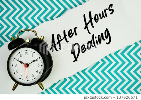 After Hours Dealing text written on paper rip with alarm clock flat lay on turquoise chevron background After Hours Dealing text written on paper rip with alarm clock flat lay on turquoise chevron background 137626671