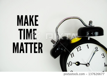 Make Time Matter text with alarm clock flat lay on white background 137626677