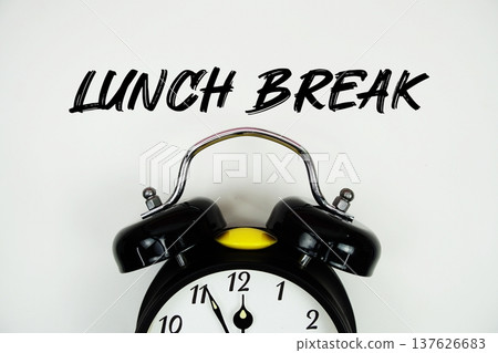 Lunch Break text with alarm clock flat lay on white background Lunch Break text with alarm clock flat lay on white background 137626683
