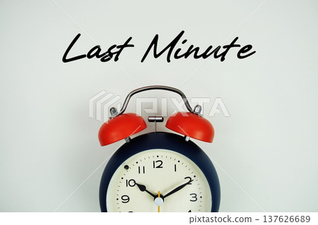 Last Minute  text with alarm clock flat lay on white background 137626689
