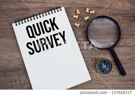 Quick Survey text written on notepad with compass and magnifying glass flat lay on wooden background Quick Survey text written on notepad with compass and magnifying glass flat lay on wooden background 137626727