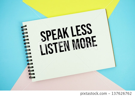 Speak Less Listen More text written on notepad flat lay on multicolor pastel background 137626762