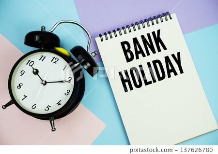 Bank Holiday text written on notepad with alarm clock flat lay on multicolor pastel background 137626780