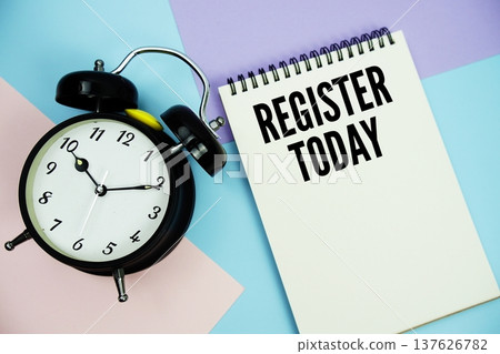 Register Today text written on notepad with alarm clock flat lay on multicolor pastel background Register Today text written on notepad with alarm clock flat lay on multicolor pastel background 137626782