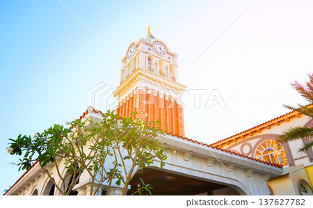 Clock tower building on sunset. Large clock tower with hour  137627782