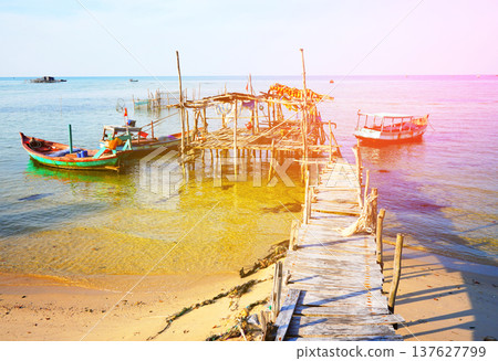 Boat at pier in sea. Landscape a traditional fishing village in Rachvem Bay on Phu Quoc Island Boat at pier in sea. Landscape a traditional fishing village in Rachvem Bay on Phu Quoc Island 137627799