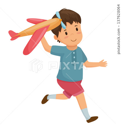 Boy Playing with a Toy Airplane 137628064