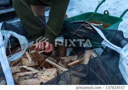 Winter Firewood Preparation by Rustic Wooden Cabin. Winter Firewood Preparation by Rustic Wooden Cabin. 137628557