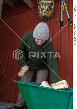 Rural Winter Lifestyle and Firewood Preparation. Rural Winter Lifestyle and Firewood Preparation. 137628560