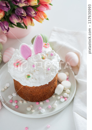 Easter Cake with Bunny Ears and Tulips. Festive Spring Composition 137630993