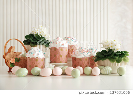Easter Cupcakes with Eggs and Bunny Basket. Festive Spring Composition Easter Cupcakes with Eggs and Bunny Basket. Festive Spring Composition 137631006