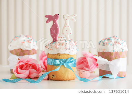 Easter cakes with Bunny Toppers and Flowers. Festive Spring Composition Easter cakes with Bunny Toppers and Flowers. Festive Spring Composition 137631014