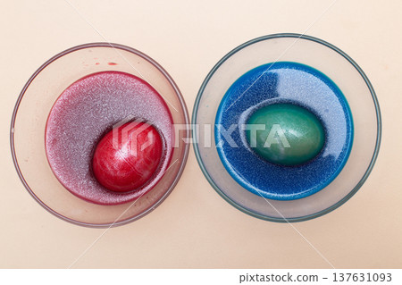 festive painted Easter eggs with colorful dyes on the table at home. festive painted Easter eggs with colorful dyes on the table at home. 137631093