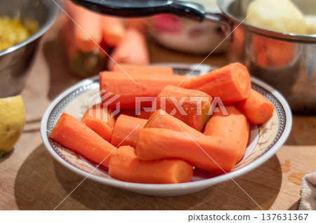 Peeled Carrot Chunks in Bowl on Kitchen Counter 137631367