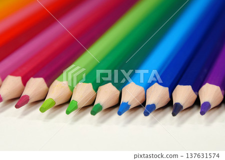 New wooden colored pencils of rainbow colors, perfectly sharpened, lie on table New wooden colored pencils of rainbow colors, perfectly sharpened, lie on table 137631574