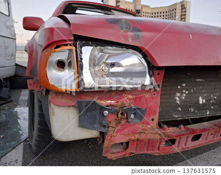 Red passenger car after an accident Red passenger car after an accident 137631575
