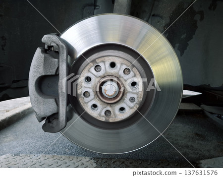 Brake disc and brake pads. Wheel disassembly and repair. Car at service station Brake disc and brake pads. Wheel disassembly and repair. Car at service station 137631576