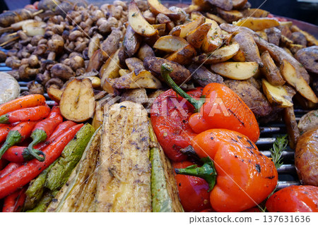Various fried foods. Red peppers, potatoes, zucchini, champignon mushrooms Various fried foods. Red peppers, potatoes, zucchini, champignon mushrooms 137631636