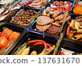 Meat sausages and frankfurters, fried potatoes, vegetables pickle 137631670