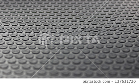 Round elements on a rubberized insulation sheet with blurred top and bottom edges. Rubber texture stock photo Round elements on a rubberized insulation sheet with blurred top and bottom edges. Rubber texture stock photo 137631720