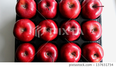 Box with compartments for storing ripe apples on clean white surface top view 137631734