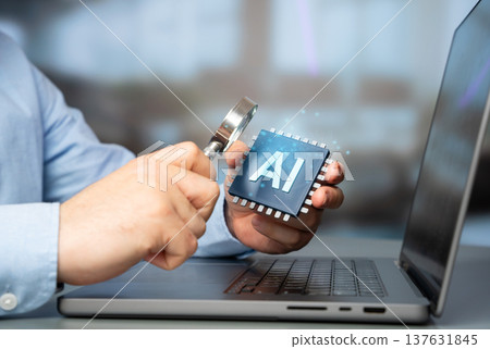 A man studies an AI chip on a computer. High technology and advanced artificial intelligence tools. Research and development of digital systems that transform industry and innovation. 137631845