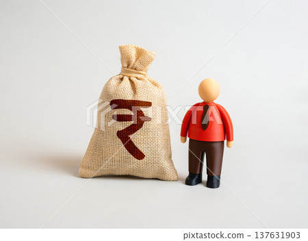 Indian rupee money bag and office worker. Cost of employee retraining as a long term investment. Prosperity of working individuals. Financial independence and wage growth. Savings, career development. Indian rupee money bag and office worker. Cost of employee retraining as a long term investment. Prosperity of working individuals. Financial independence and wage growth. Savings, career development. 137631903