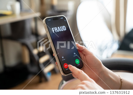 A woman receives a call from scammers. Personal data protection and awareness of phone fraud. Rules for avoiding scams, cybersecurity threats and social engineering attacks. A woman receives a call from scammers. Personal data protection and awareness of phone fraud. Rules for avoiding scams, cybersecurity threats and social engineering attacks. 137631912