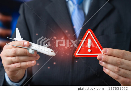 A passenger plane and a red attention sign. Breaking aviation news and emergency alert. Symbol of critical problems in air transport, safety warnings and urgent aviation incidents. A passenger plane and a red attention sign. Breaking aviation news and emergency alert. Symbol of critical problems in air transport, safety warnings and urgent aviation incidents. 137631932
