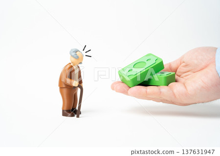 An elderly man is handed money. Pension payments, benefits and compensation programs. Social assistance and insurance for older citizens, financial security and healthcare protection for retirees. An elderly man is handed money. Pension payments, benefits and compensation programs. Social assistance and insurance for older citizens, financial security and healthcare protection for retirees. 137631947