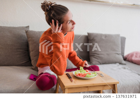 Woman struggling with portion control and eating disorder Woman struggling with portion control and eating disorder 137631971