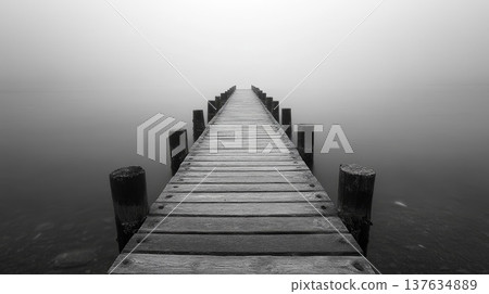 Serene Long Wooden Pier Extending Over Tranquil Waters, Perfect for Relaxation and Scenic Views 137634889
