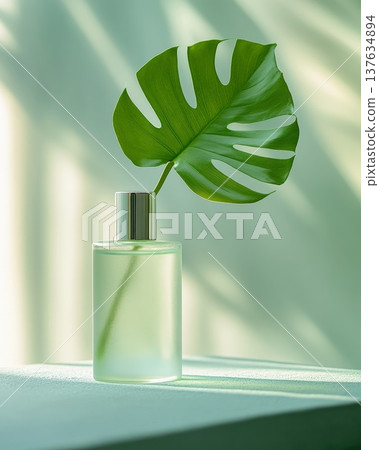 Elegant Green Leaf in a Crystal Clear Glass Vase on a Minimalist Table Setting, Capturing Natural Beauty 137634894