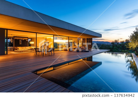 Contemporary Home Featuring an Inviting Outdoor Pool Surrounded by Stylish Decking and Lush Landscaping Contemporary Home Featuring an Inviting Outdoor Pool Surrounded by Stylish Decking and Lush Landscaping 137634942