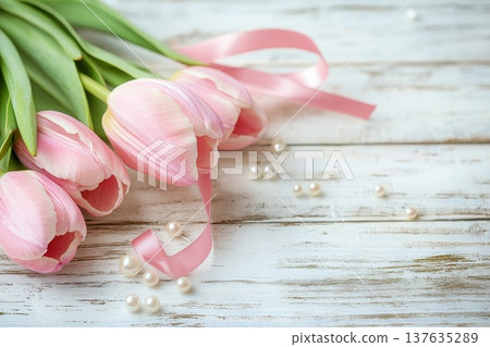 Beautiful bouquet of pink tulips adorned with pearls on a rustic white wooden table, capturing elegance and charm. Beautiful bouquet of pink tulips adorned with pearls on a rustic white wooden table, capturing elegance and charm. 137635289