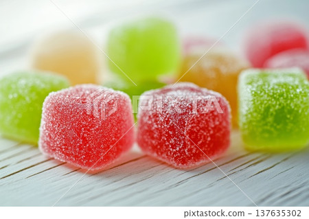 A Colorful Close Up of a Group of Gummy Bears Glistening in Soft Light on a Bright Surface A Colorful Close Up of a Group of Gummy Bears Glistening in Soft Light on a Bright Surface 137635302