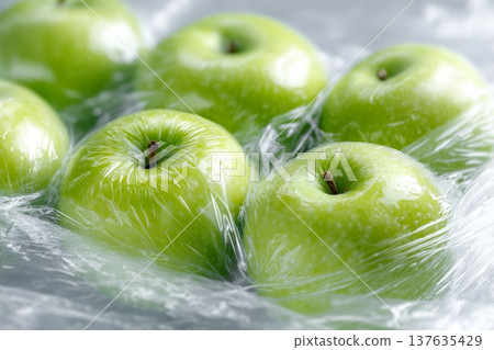 Fresh green apples packed under film, close-up Fresh green apples packed under film, close-up 137635429
