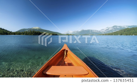 An orange boat in a beautiful clear lake in the middle of a mountain landscape on a sunny day An orange boat in a beautiful clear lake in the middle of a mountain landscape on a sunny day 137635451