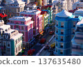 A city with houses, streets, and cars stylized like Lego bricks 137635480