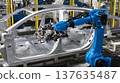 An industrial robot welds a car frame on a modern automated assembly line in an automotive factory. 137635487