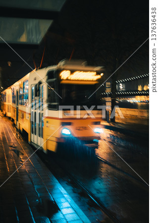 Blurred Tram Arriving On Rainy Night Blurred Tram Arriving On Rainy Night 137636438