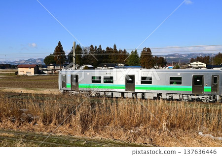 Tohoku Main Line in the morning. New HB-E220 series diesel car. Tohoku Main Line in the morning. New HB-E220 series diesel car. 137636446