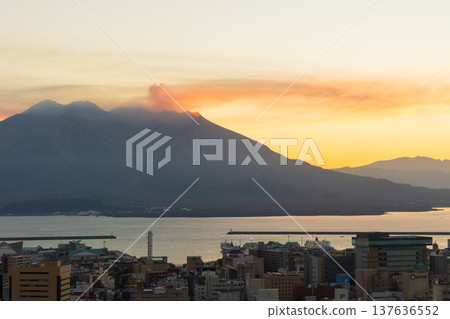 Autumn in Kagoshima City, Kagoshima Prefecture: A view of Sakurajima from Shiroyama Park at dawn. 137636552