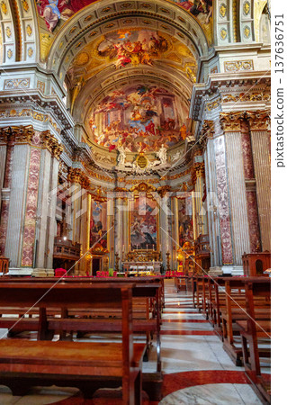 Church interior shows detailed architecture and religious art in sunlight Church interior shows detailed architecture and religious art in sunlight 137636751