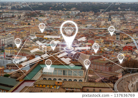 Overhead view of city with digital map markers for shops and services at sunset 137636769