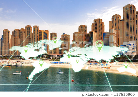 View of a beach area with city buildings and a world map overlay showing location markers View of a beach area with city buildings and a world map overlay showing location markers 137636900