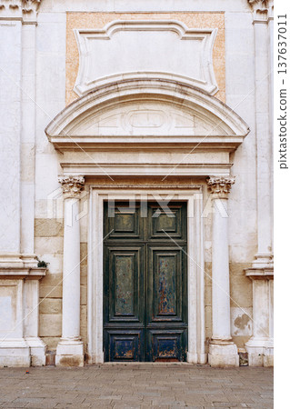 Old wooden door with stone structure in a historic building during daytime 137637011