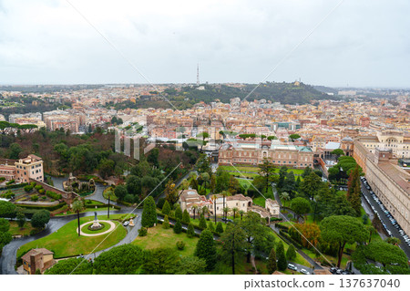 View of Rome from a high point showing buildings, trees, and cloudy weather View of Rome from a high point showing buildings, trees, and cloudy weather 137637040