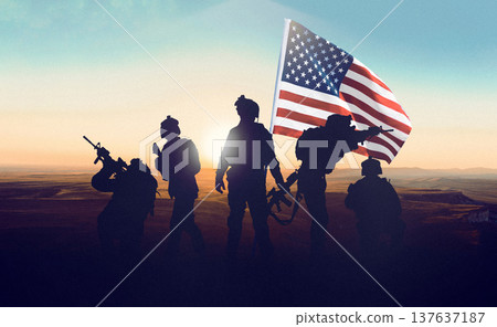US soldiers stand together with an American flag during a conflict in Iran at sunset US soldiers stand together with an American flag during a conflict in Iran at sunset 137637187