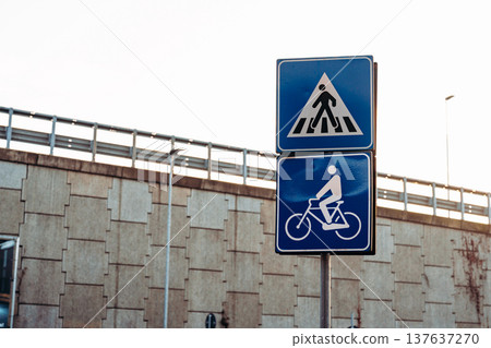 Sign shows pedestrian crossing and bike lane, indicating safe road use for all Sign shows pedestrian crossing and bike lane, indicating safe road use for all 137637270